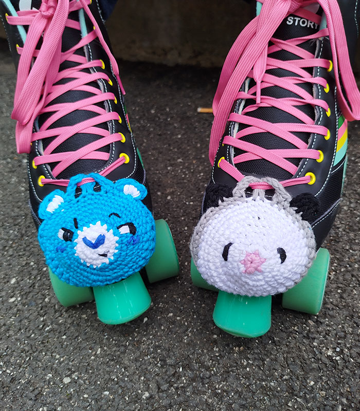 Grumpy Bear and possum roller skates toe guards